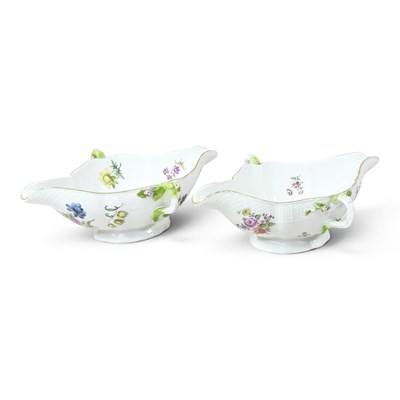 Lot 137 - A pair of Meissen style porcelain sauce boats,...