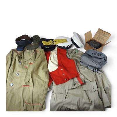 Lot 490 - A collection of military issue uniforms and hats