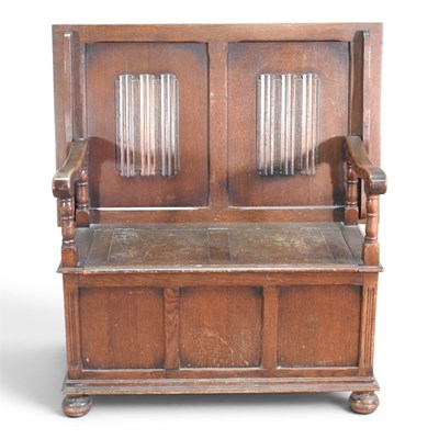 Lot 725 - A 1930s oak monk's bench, the hinged back with...
