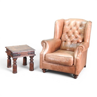 Lot 49 - A modern brown leather upholstered button back...