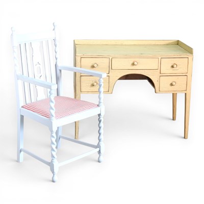 Lot 633 - A cream painted pine writing desk, together...