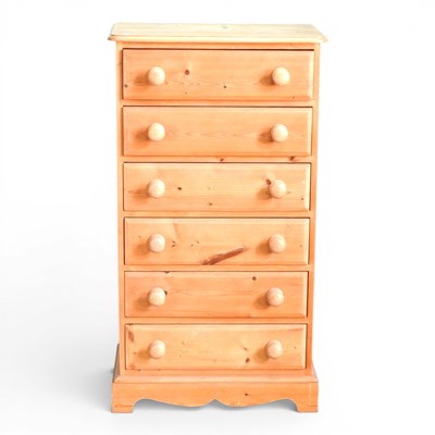 Lot 109 - A modern narrow pine chest, containing a row...