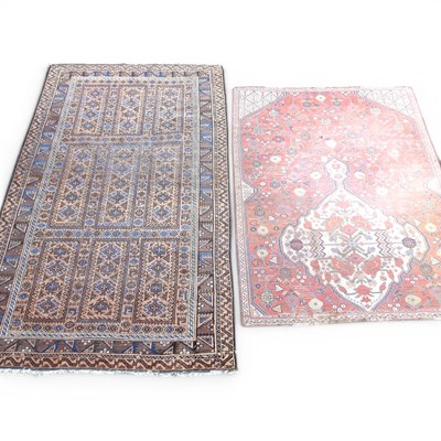 Lot 734 - An Afghan rug, with geometric designs on a...