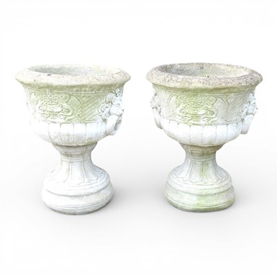 Lot 140 - A pair of reconstituted stone garden urns, of...