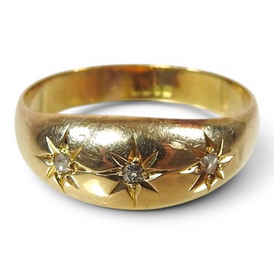 Lot 338 - An 18 carat gold and diamond three stone gypsy...