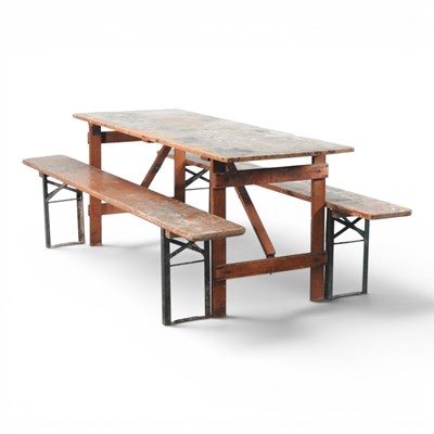 Lot 647 - A wooden folding trestle table, 182cm wide,...