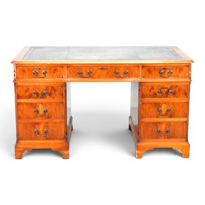 Lot 642 - A reproduction yew wood twin pedestal desk,...
