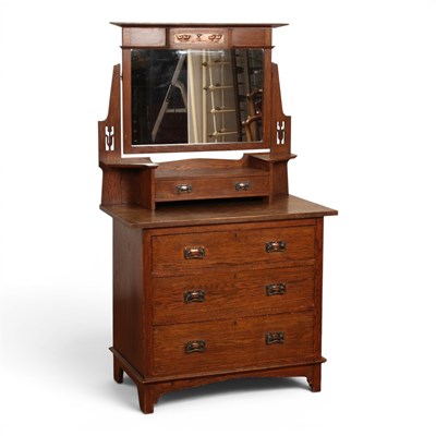 Lot 574 - An Arts and Crafts oak dressing chest, having...