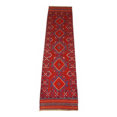 Lot 539 - A Meshwani red runner, 240x63cm.