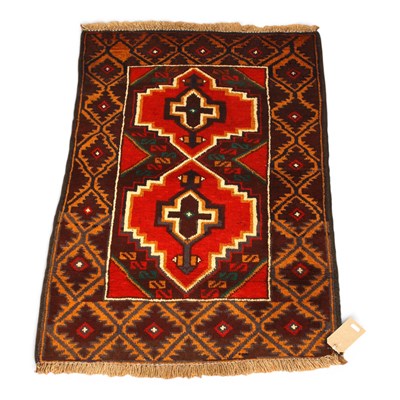 Lot 558 - A Baluchi red rug, 114x79cm.