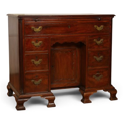 Lot 520 - A George III mahogany kneehole desk