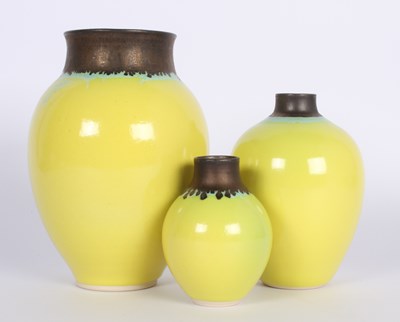 Lot 177 - A collection of three yellow and bronze glazed...