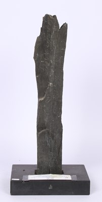 Lot 203 - A tall dark slate monolith sculpture on a...