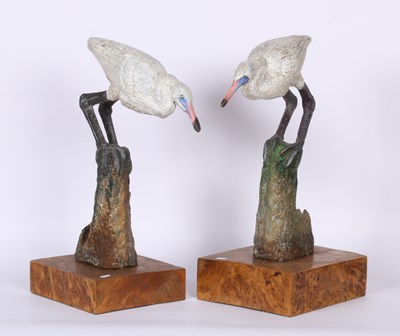 Lot 204 - A pair of coastal bird statues, perched on...