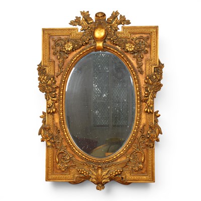 Lot 566 - A French style ornate gold gilt oval mirror...