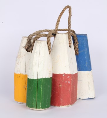 Lot 760 - A collection of four vintage wooden buoys from...