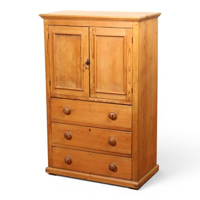 Lot 580 - A tall pine cupboard or chest