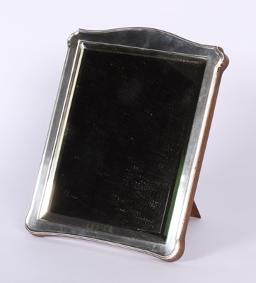 Lot 35 - A 1920's silver clad easel table mirror, with...