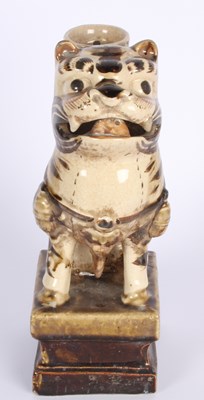 Lot 730 - A Chinese pottery model of a guardian lion