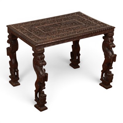 Lot 512 - An Anglo Indian heavily carved hardwood side...