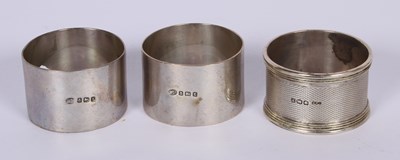 Lot 51 - Three various silver napkin rings, 83g