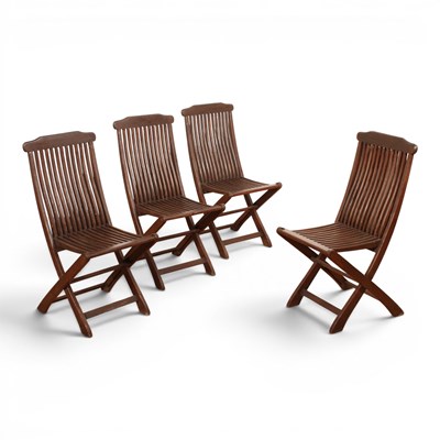 Lot 583 - A set of four teak folding garden chairs