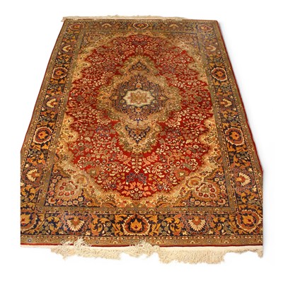 Lot 506 - A fine Persian silk rug, profusely decorated...