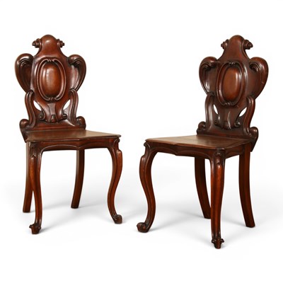 Lot 567 - A pair of Victorian mahogany hall chairs