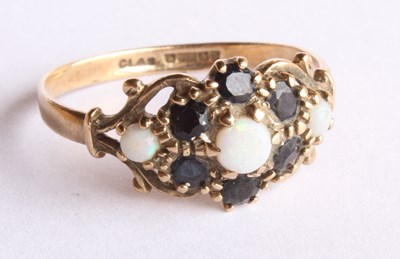 Lot 22 - A 9 carat yellow gold sapphire and opal dress...