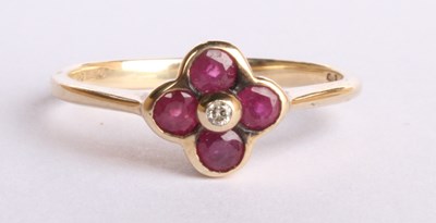 Lot 19 - A 9 carat yellow gold ruby and diamond cluster...