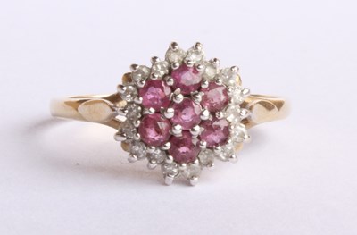 Lot 32 - A 9 carat yellow gold ruby and diamond cluster...