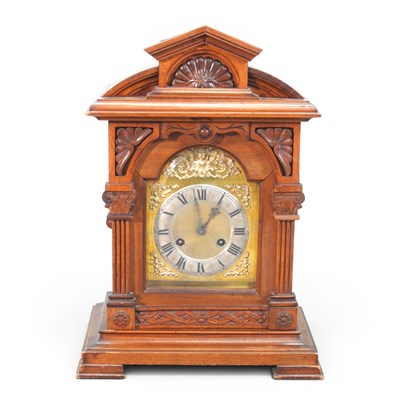 Lot 8 - A late 19th century walnut cased mantel clock,...