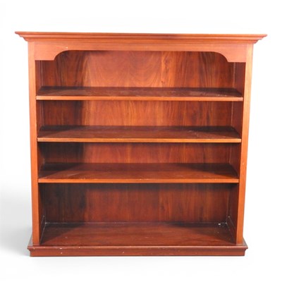 Lot 565 - A hardwood dwarf open bookcase