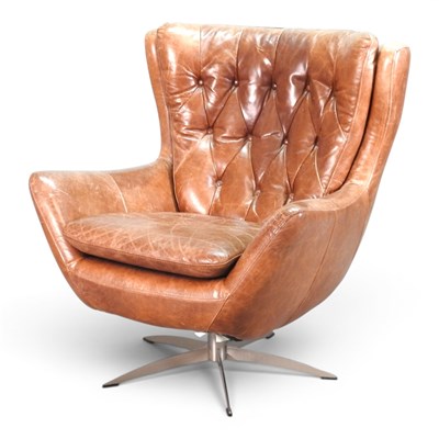 Lot 76 - A 1970s style brown leather upholstered swivel...