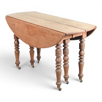 Lot 510 - A 19th century pine drop leaf extending dining...