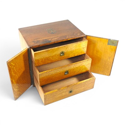 Lot 57 - An early 20th century oak three drawer...