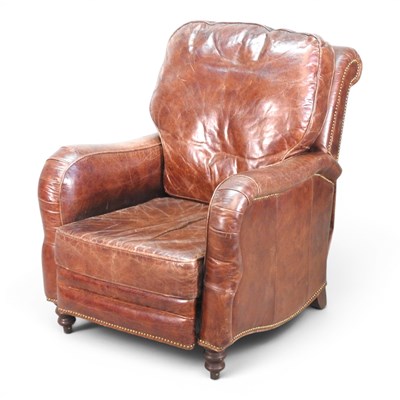 Lot 220 - A modern brown leather upholstered reclining...