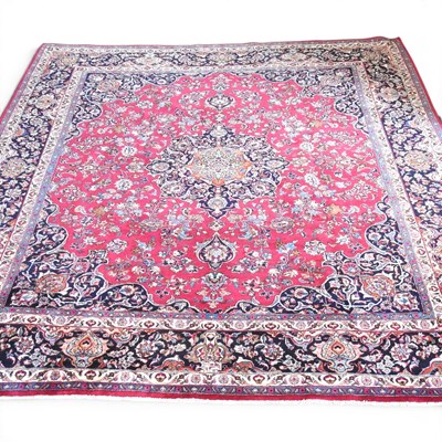 Lot 389 - A large Persian meshed carpet, with a central...