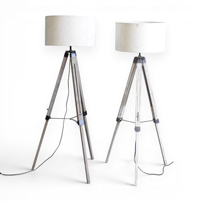 Lot 525 - A pair of limed standard lamps and shades,...