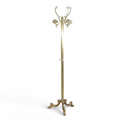 Lot 390 - An ornate brass coat stand, on a tripod base,...