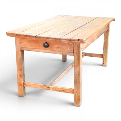Lot 52 - A rustic antique pine refectory dining table,...