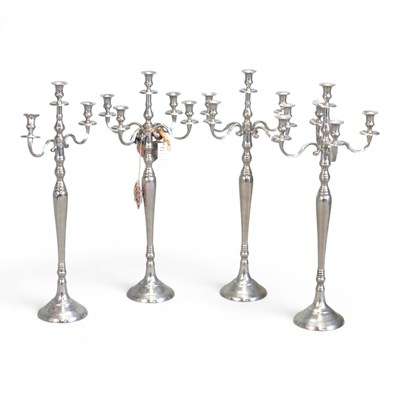 Lot 193 - A set of four metal table candelabra, 81cm...