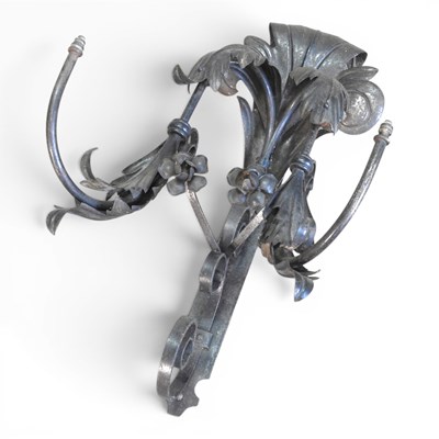Lot 75 - An ornate metal wall sconce, 75cm high