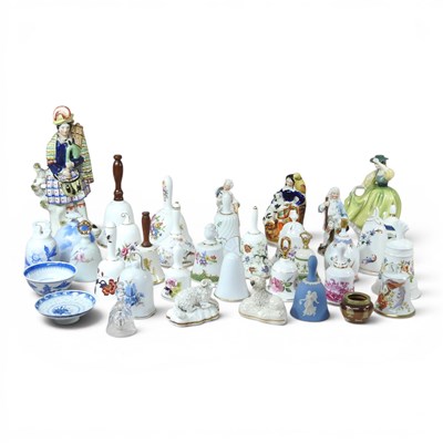 Lot 556 - A collection of porcelain bells from around...