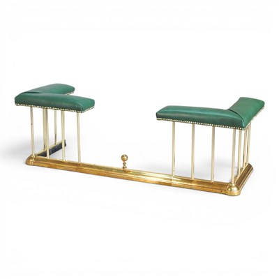 Lot 144 - A mid 20th century brass club fender, with a...