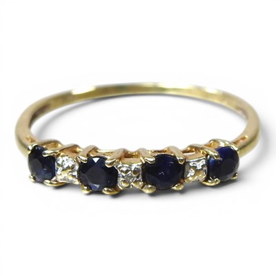 Lot 234 - A 9 carat gold sapphire and diamond ring, set...
