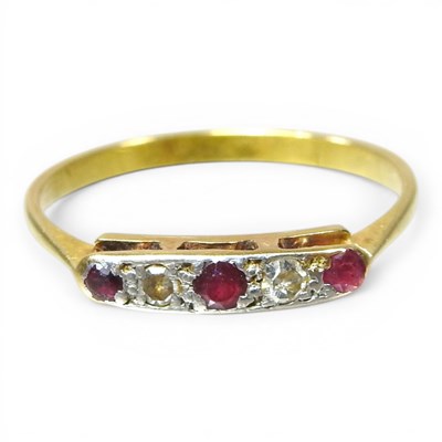 Lot 244 - An 18 carat gold ruby and diamond five stone...