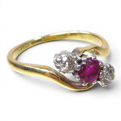Lot 171 - An 18 carat gold ruby and diamond three stone...