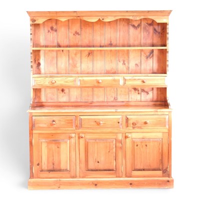 Lot 527 - A modern pine dresser, with a boarded back on...