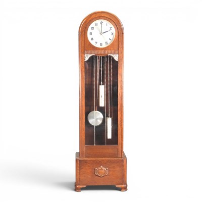 Lot 457 - A 1920s oak cased longcase clock, with a...